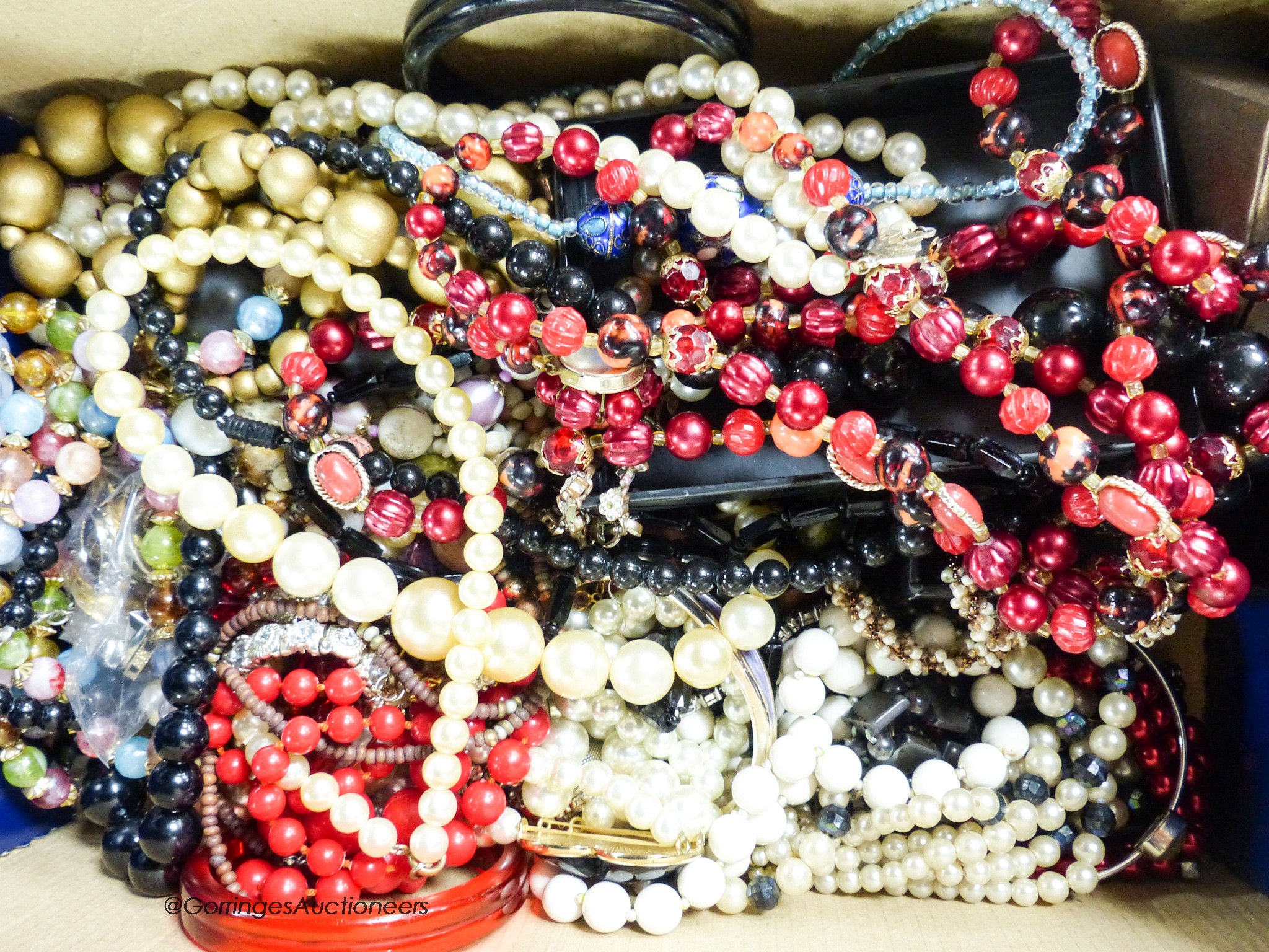 A box of costume jewellery.